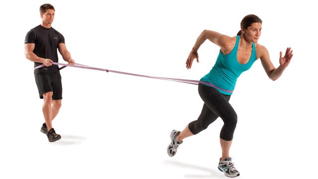 Buddy up to do some resistant band sprints